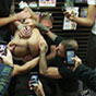 Hunk sucks cocks in public