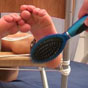 Feet hairbrush spanking